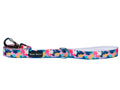 Floral-patterned dog leash with a clip on a blue background