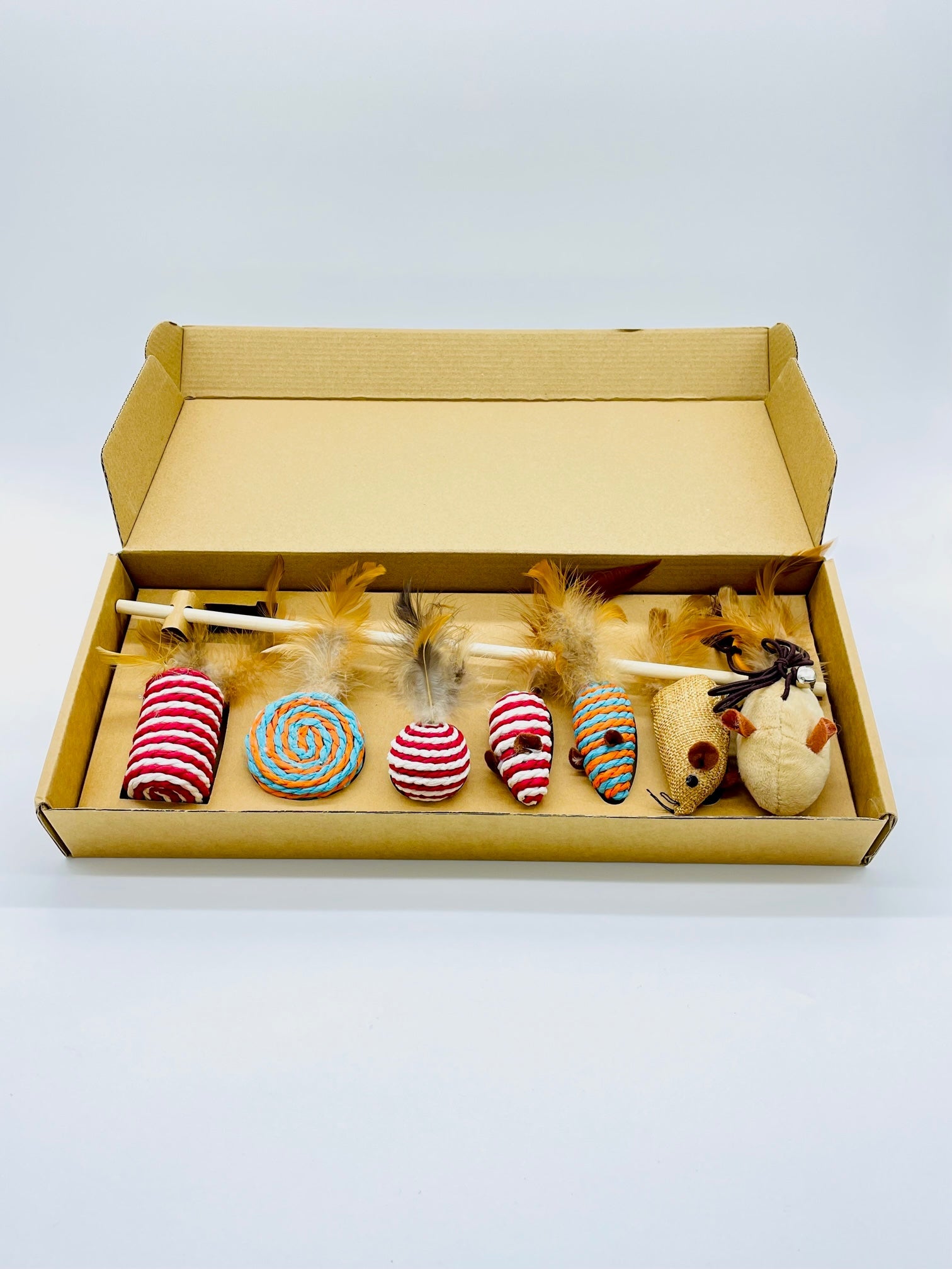 MR Toulouse Pet Shop Set of cat toys in a cardboard box on a white background