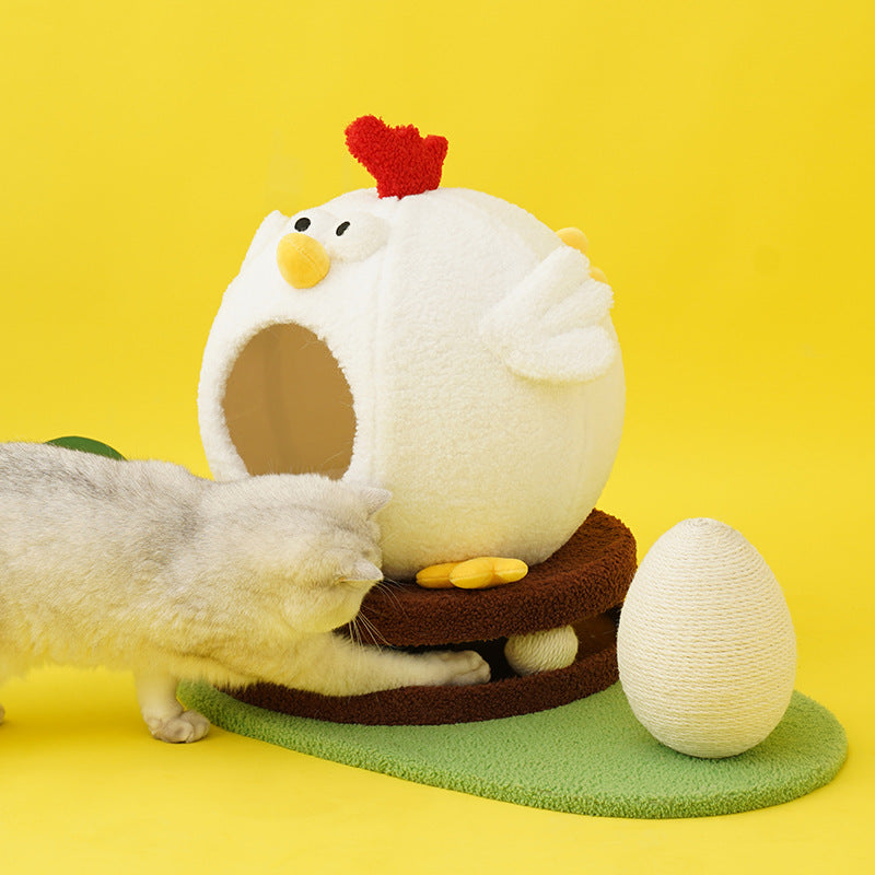 Cat playing with a chicken-shaped pet bed and egg on a yellow background