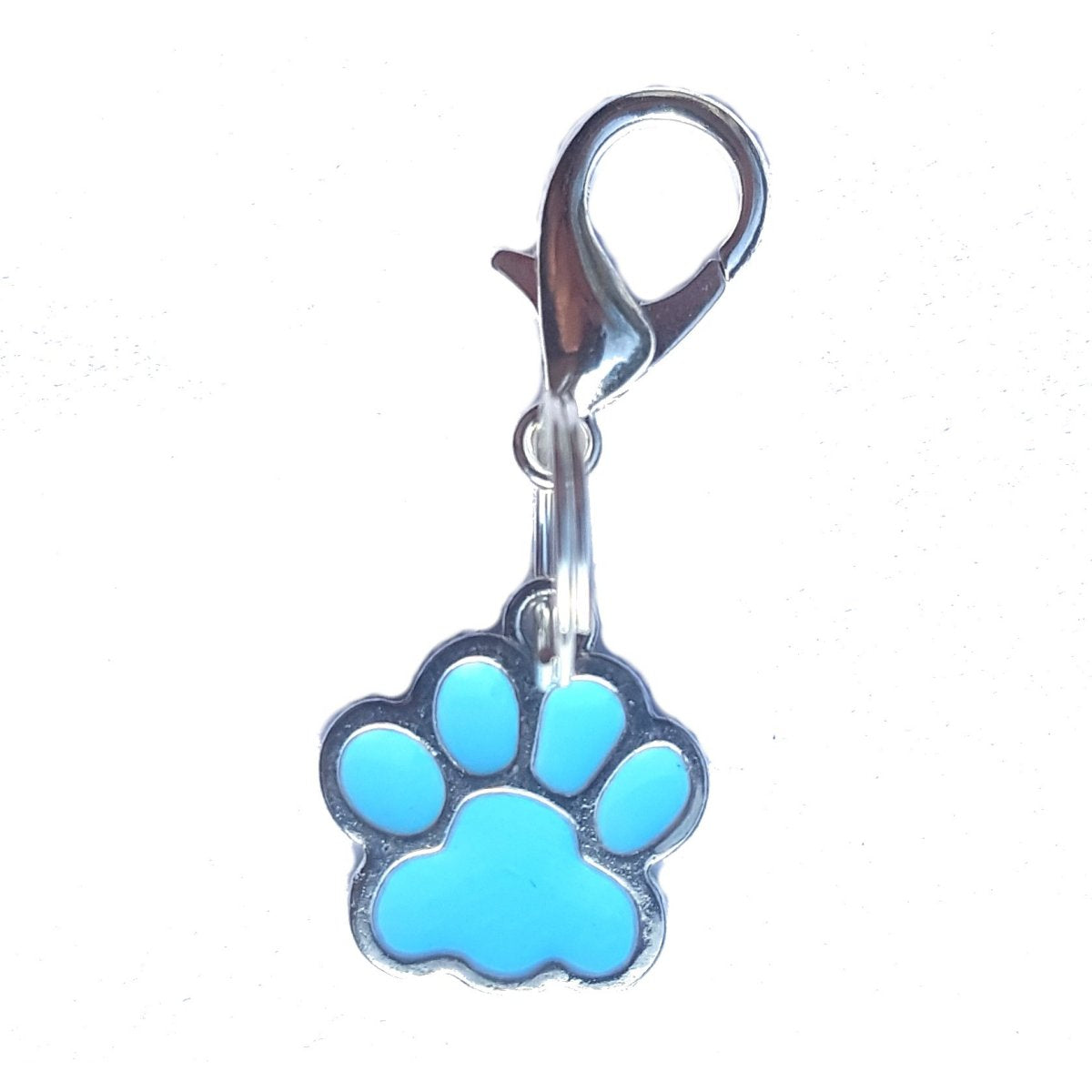 Blue paw print charm with a clip on a white background